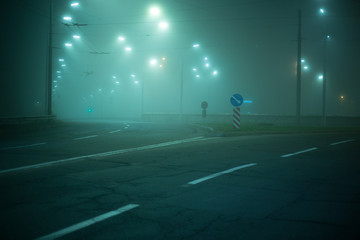Fototapeta na wymiar Highway road at night in the fog in the city
