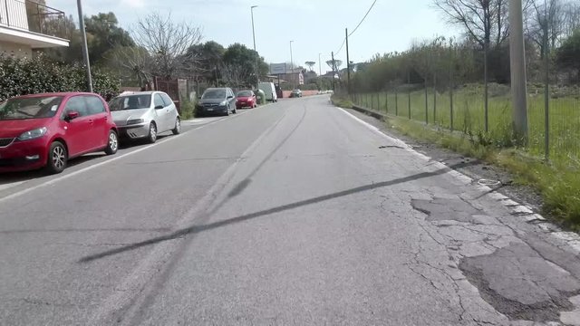 a video shot with poket osmo by a car in traffic in the city of Rome