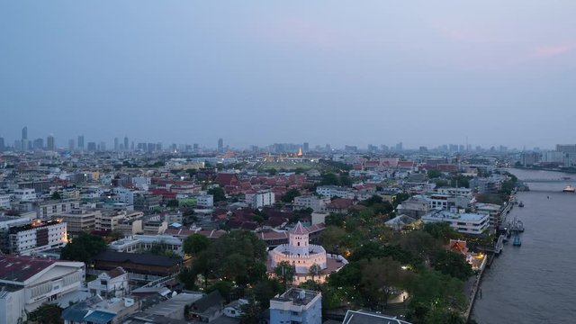 Day to night time lapse of Phra Sumen Fort, Temple of Emerald Buddha, Grand palace, and Sanam Luang, Wat Phra Kaew, and skyscraper buildings. Bangkok City in downtown at night, Thailand.