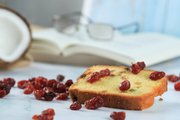 A slice of toast with red berries on the table