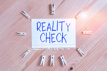 Conceptual hand writing showing Reality Check. Concept meaning one is reminded of the state of...