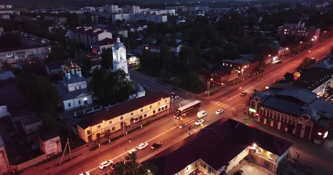 Night aerial view of Russian town of Pokrov with Cathedral of Intercession of Holy Virgin and busy M7 highway