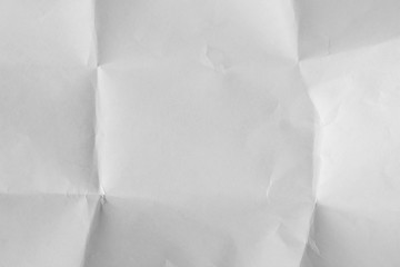 Obraz premium Лист белой бумаги смятый а потом расправленный Выборочный фокус. 