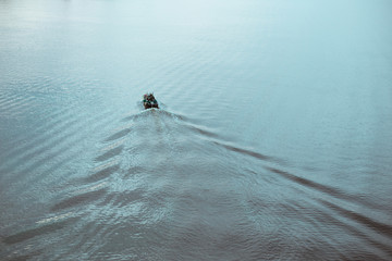 A guy and a girl canoe paddling the river
