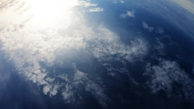 Cloudy Day With Blue Sky And Sun Showing Trough Clouds