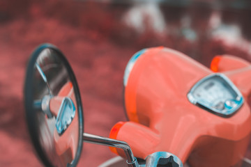 Reflection in the side mirror of a motorbike