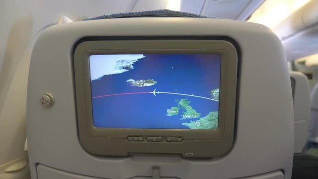 Travel map on airplane board during the flight in 4K Slow motion 60fps