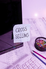 Writing note showing Cross Selling. Business concept for to sell complementary products to an...