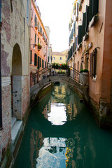 Obraz na płótnie Canvas Traditional Venice Cityscape with narrow canal, gondola