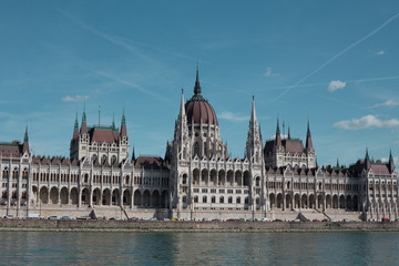 Fototapeta premium Budapest Parliament Building in the afternoon against a clear blue sky