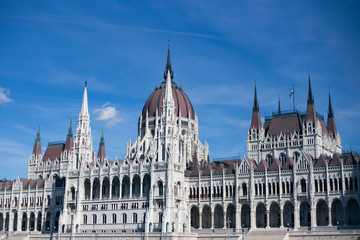 Fototapeta premium Budapest Parliament Building in the afternoon against a clear blue sky