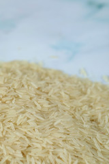 Dry and fresh asian rice stock in the bottom of the photo