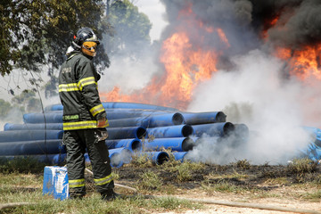 Fireman preparing to stop the flames