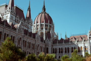 Fototapeta premium Budapest Parliament Building in the afternoon against a clear blue sky