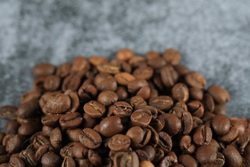 Fresh coffee beans for wholesale, on the bottom of the background