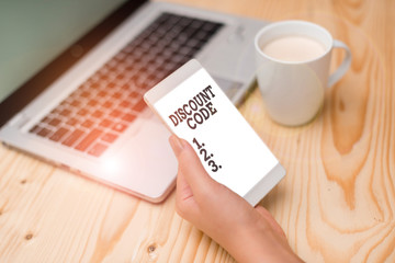 Conceptual hand writing showing Discount Code. Concept meaning Series of letters or numbers that...