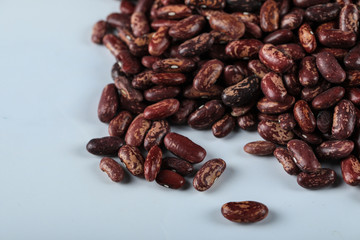 Red dry beans isolated on blue background