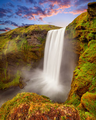 Panoramic view of Skogafoss waterfall on the Skoga river, a popular tourist attraction and part of...