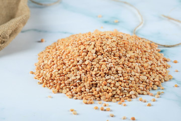 Yellow beans spread over the center of the marble
