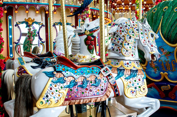 Fototapeta na wymiar Beautiful carousal horses on a merry go round