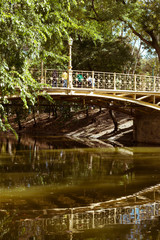 Fototapeta na wymiar Old yellow metal arch bridge