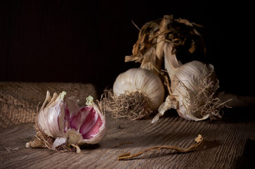 Garlic on wooden table.