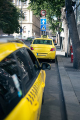 Yellow taxi car in the city center