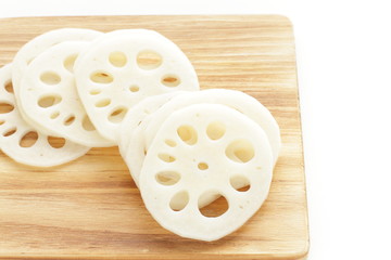 freshness lotus roots sliced on wooden board with copy space