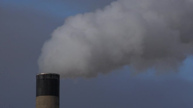 Manchester power station and chimneys with smoke UK 4K