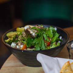 Mixed green salad with cheese and avocado