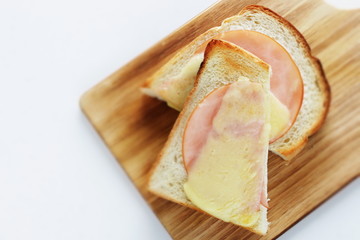 Toasted cheese and ham on English bread for comfort breakfast