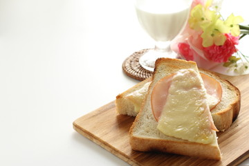 Toasted cheese and ham on English bread for comfort breakfast