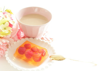 Cherry jelly on plate with tea for dessert