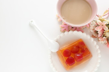 Cherry jelly on plate with tea for dessert