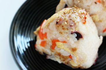 Japanese food, chicken and carrot rice ball on dish