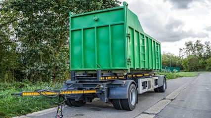 Green skip (dumpster) for municipal waste  . Utilities do their job