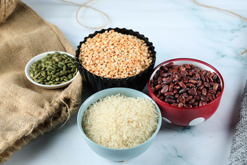 Red beans, rice and peas in colorful bowles