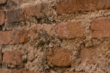 Old weathered red brick wall