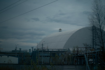 Fototapeta premium Sarcophagus over the 4th power unit of a nuclear power plant in Pripyat in Chernobyl