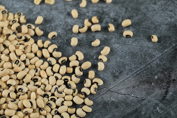 White dry beans spread over the left side of the table