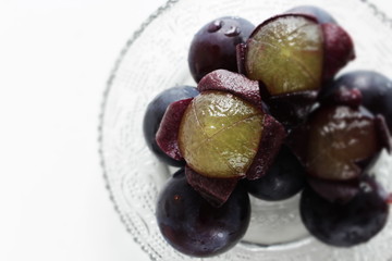 peeled Japanese grape on dish with copy space