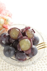 peeled Japanese grape on dish with copy space