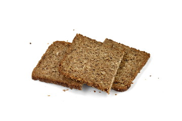 Slices of wholemeal dark bread isolated on a white background in close-up 