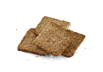 Slices of wholemeal dark bread isolated on a white background in close-up 