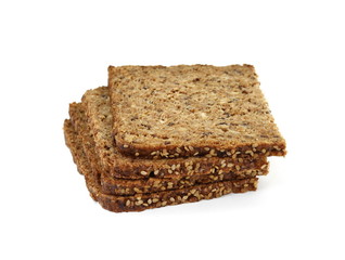 Slices of wholemeal dark bread isolated on a white background in close-up 