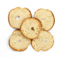 Bake rolls. Mini bread chips isolated on white background. Round bread slices.
