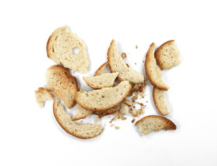 Bake rolls. Mini bread chips isolated on white background. Round bread slices.