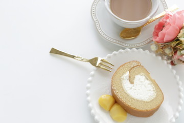 Swiss roll slice served with chestnut on white dish