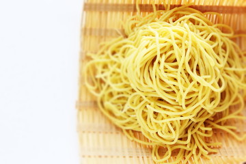 Chinese ramen noodles in basket with copy space 