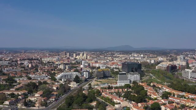 Montpellier aiguerelles neighborhood aerial sunny day France view over the city and pic saint loup mountain
